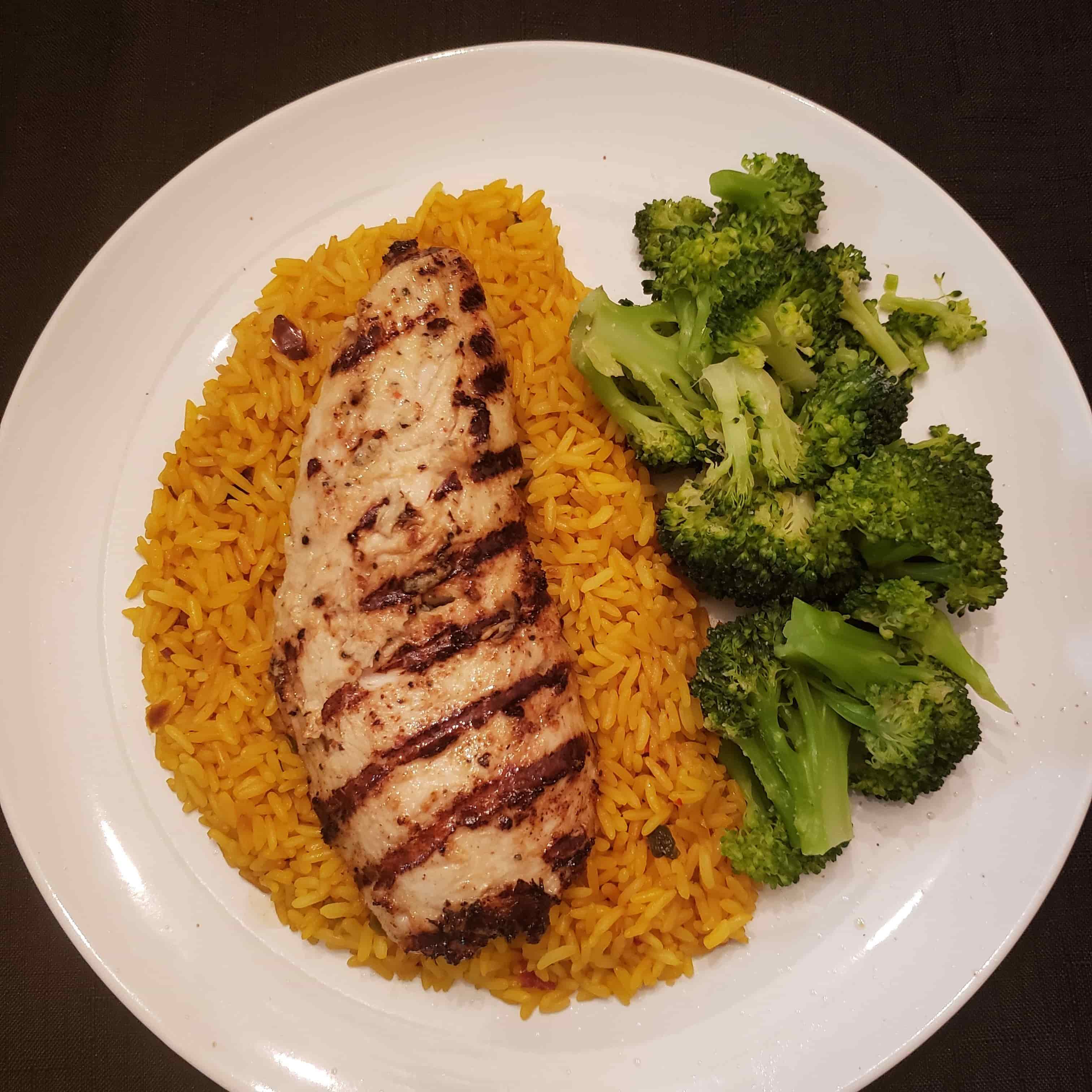Picture of salmon over rice with broccoli